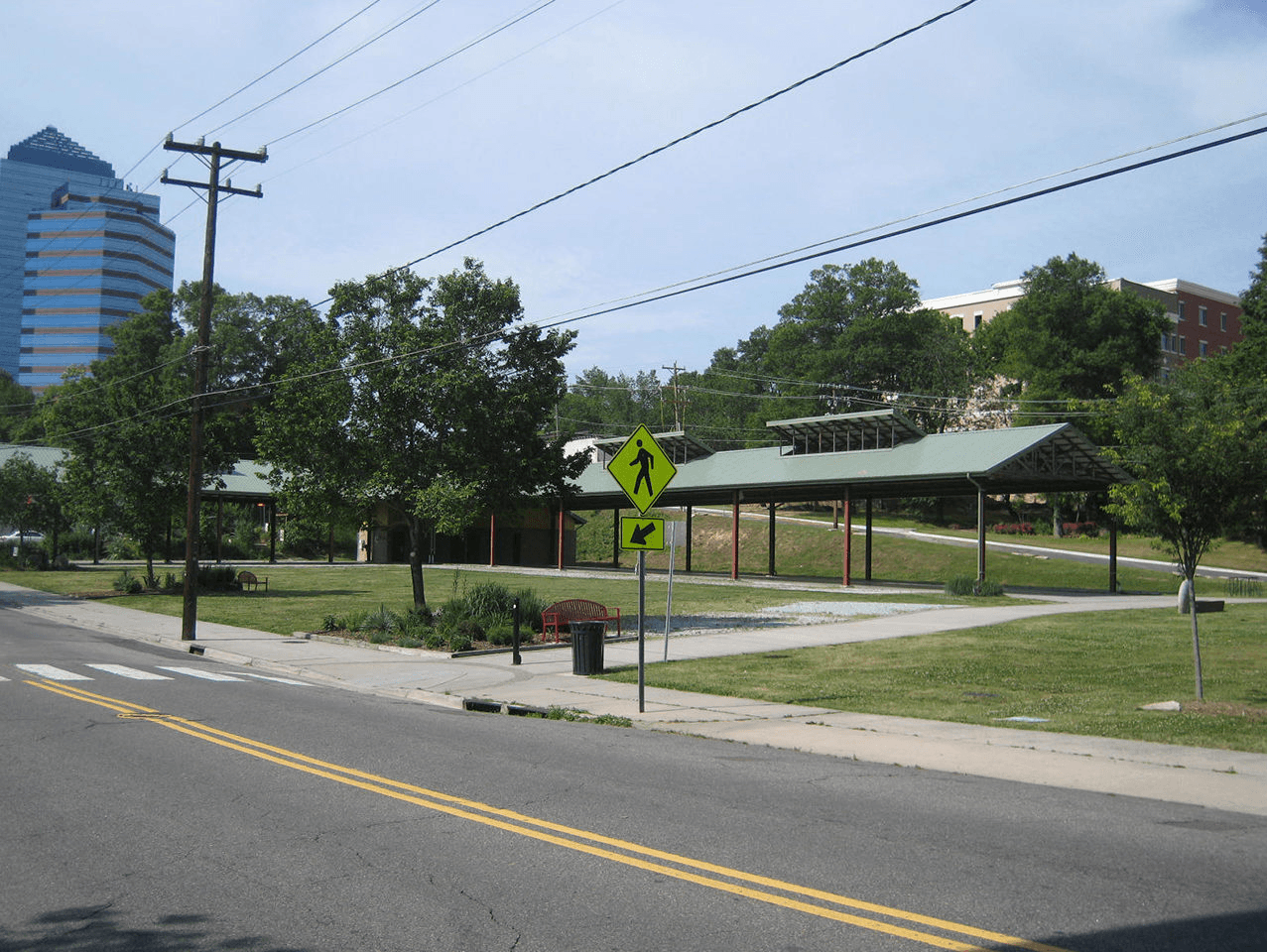 bus stop on the side of the road