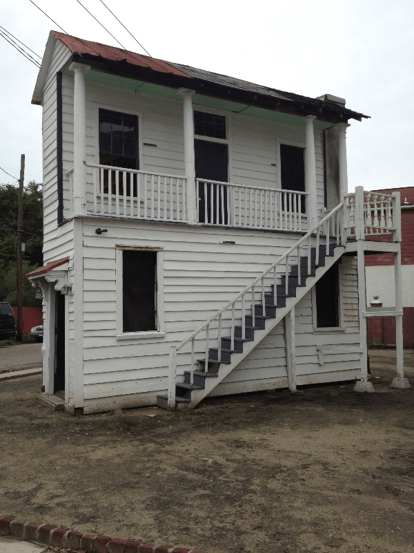 a white house with a staircase going up