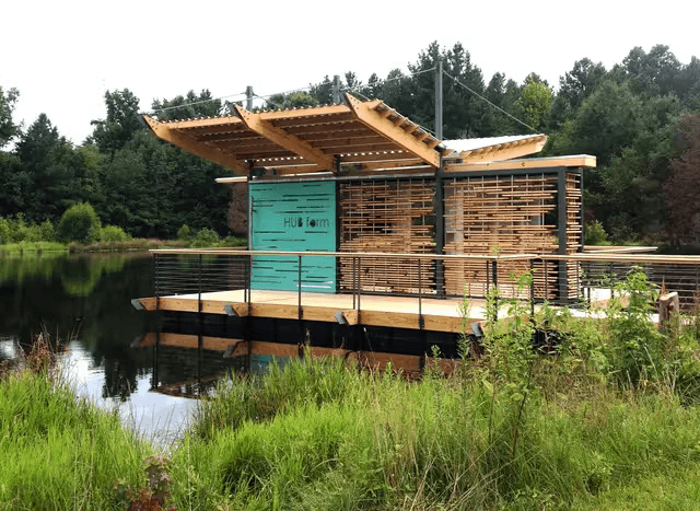 a large wooden structure on a lake